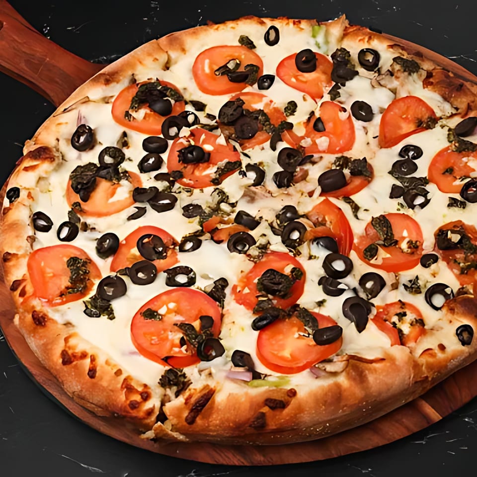 A whole Boba & Pizza Corner pizza with tomatoes, black olives, and cheese on a wooden board.